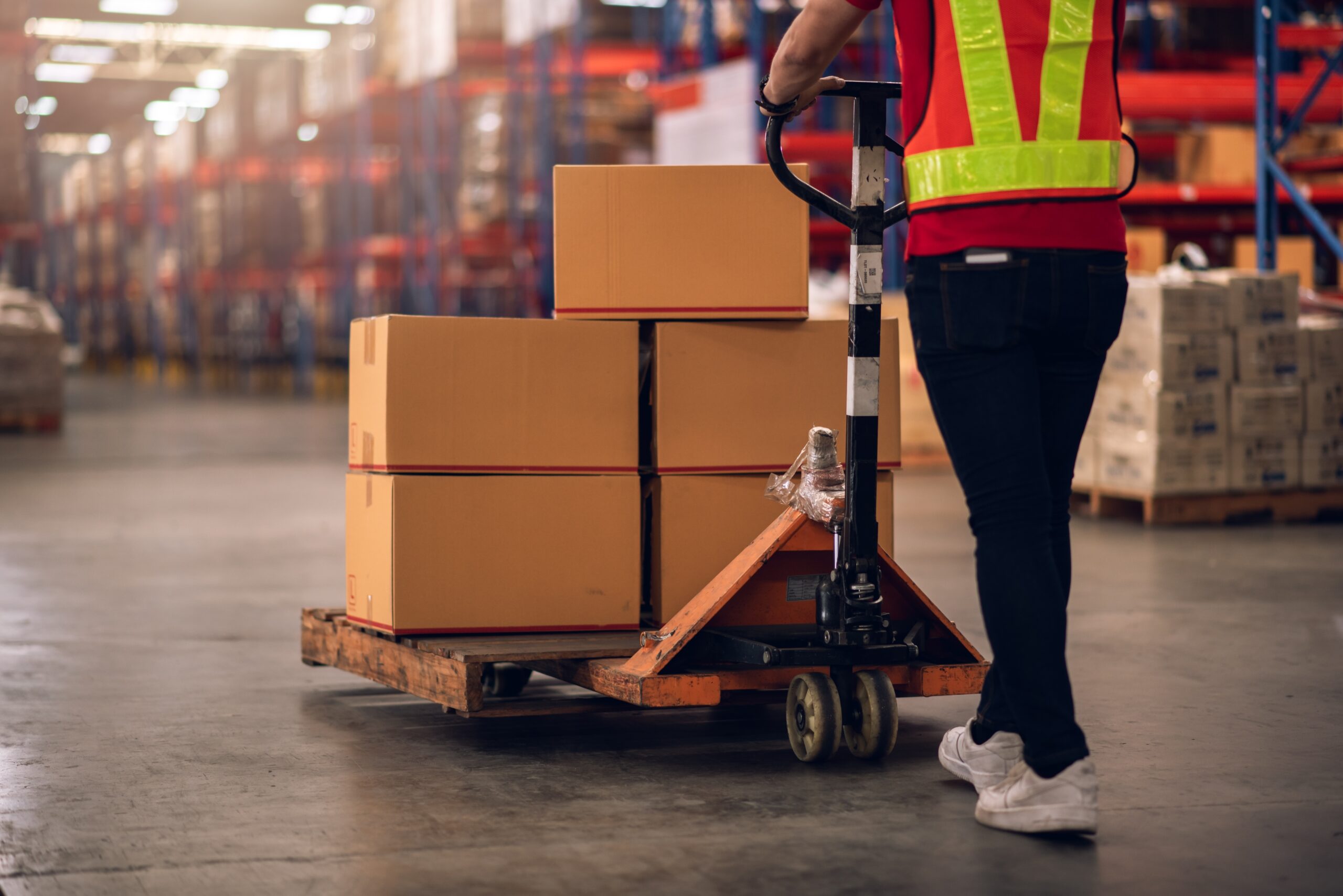 Factory,Worker,Using,Hand,Pallet,Truck,To,Move,Carton,Box Factory,Worker,Using,Hand,Pallet,Truck,To,Move,Carton,Box